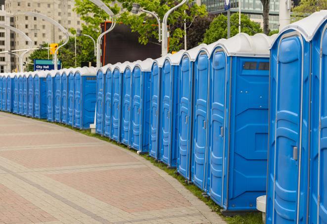 a line of portable restrooms at an outdoor wedding, catering to guests with style and comfort in Alvin, TX